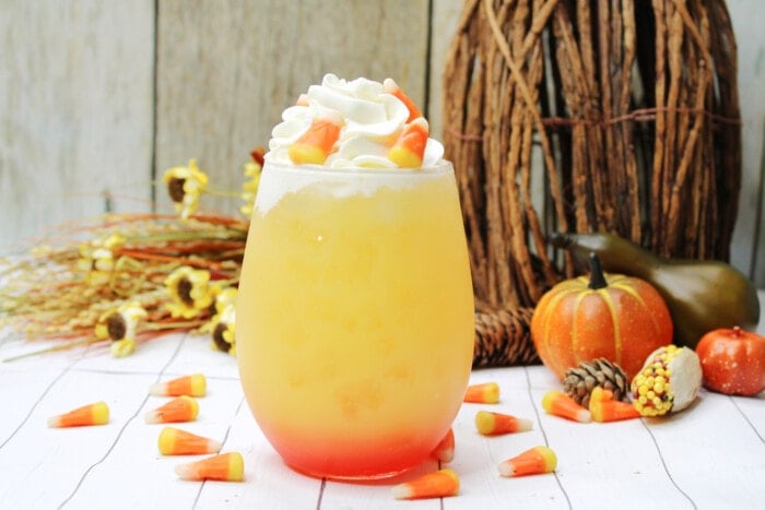 Candy Corn Cocktail in a clear glass.
