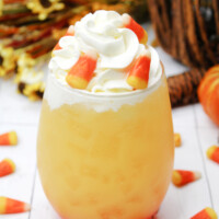 Candy Corn Cocktail topped with whipped cream.