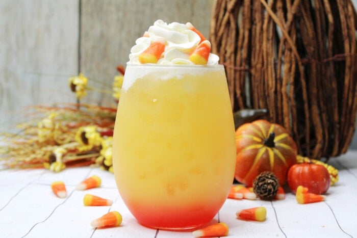 Candy Corn Cocktail topped with candy pieces.