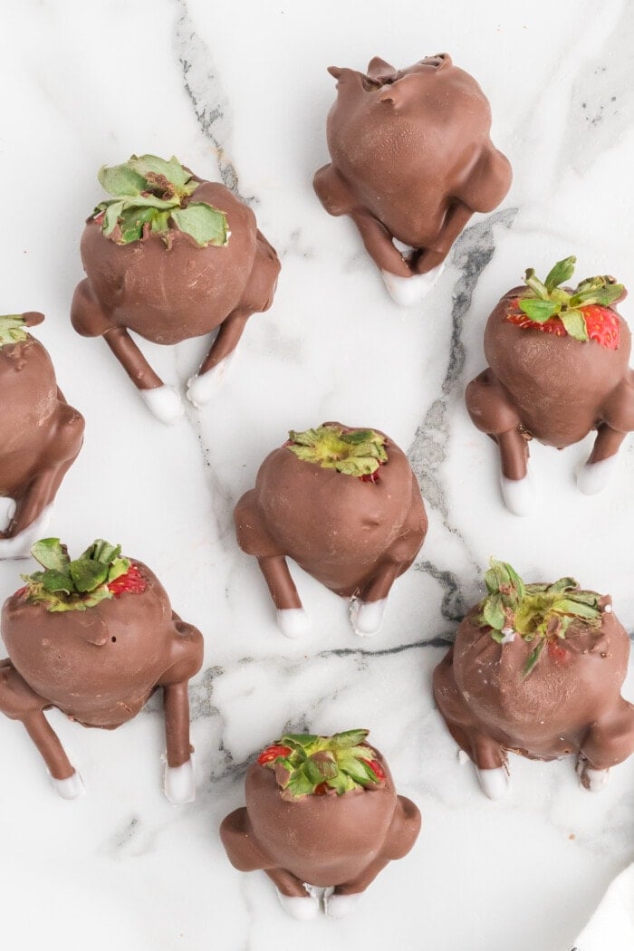 Chocolate-Covered Strawberry Turkeys on a marble white table.