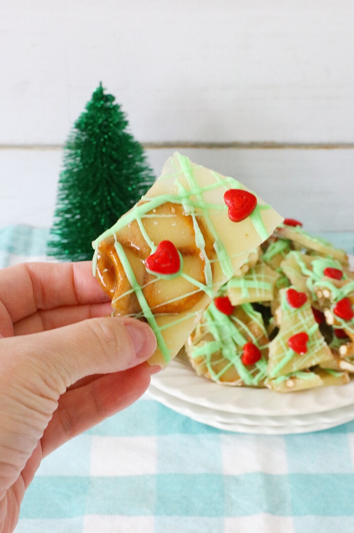 A hand holding Grinch Brittle.