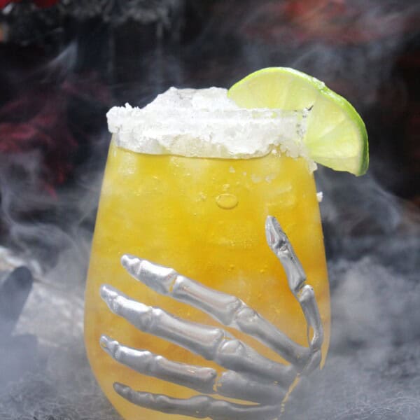 The recipe in a glass with spooky decorations.