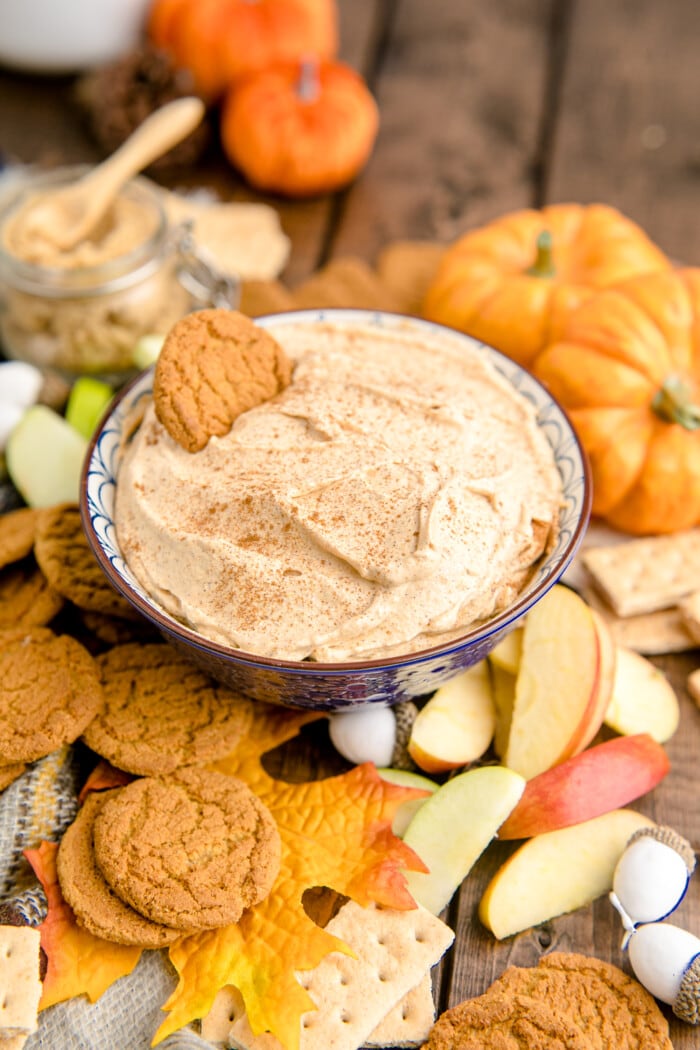 Pumpkin Fluff Dip surrounded by cookies.