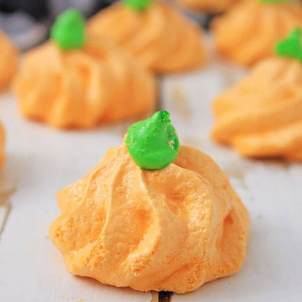 Pumpkin Meringues on a white table.