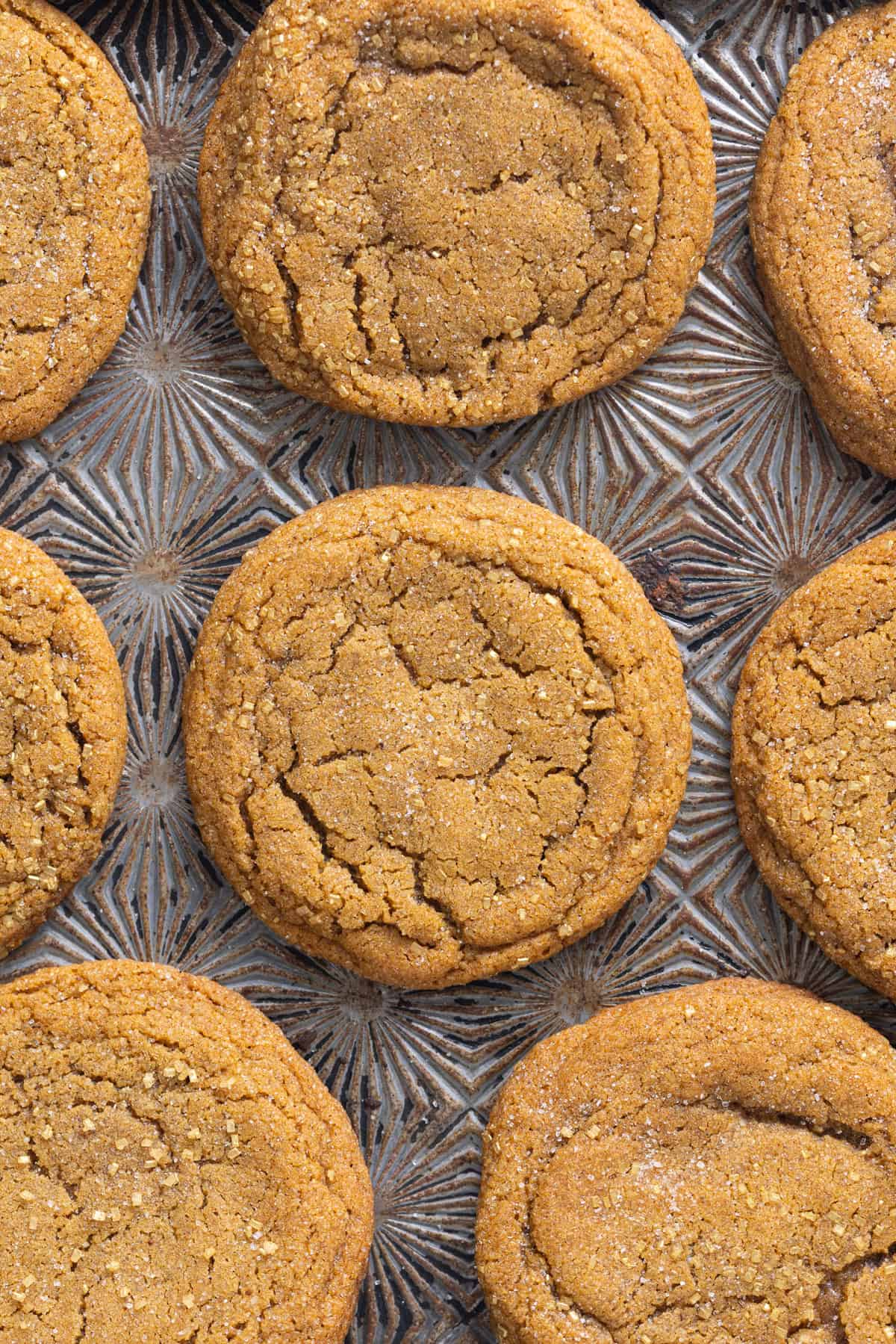 Soft and chewy, these Pumpkin Spice Cookies are perfectly spiced and bake in just 10 minutes! Quick & easy to make. Overhead view of pumpkin spice cookies on a baking sheet