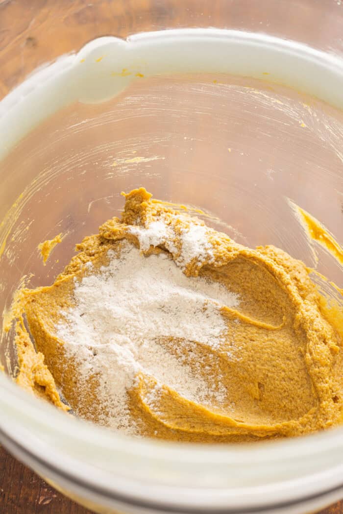 Soft and chewy, these Pumpkin Spice Cookies are perfectly spiced and bake in just 10 minutes! Quick & easy to make. Combining wet and dry cookie dough ingredients