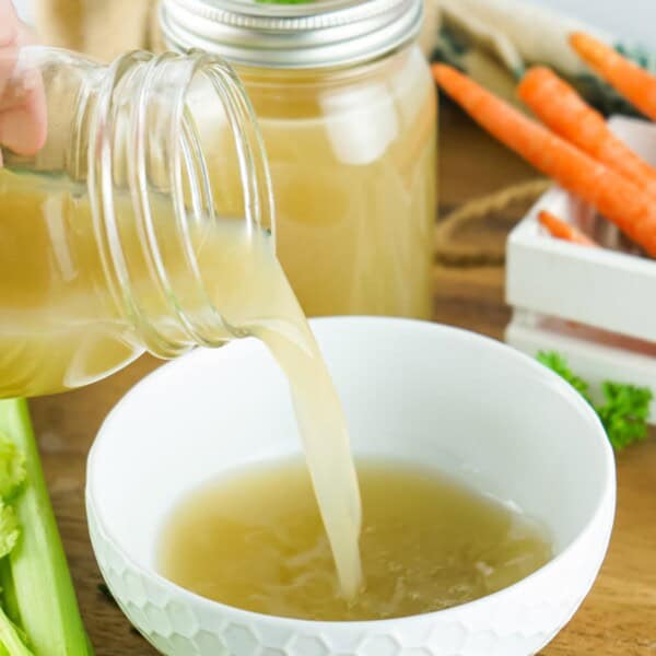 pouring the Turkey Stock into a bowl.