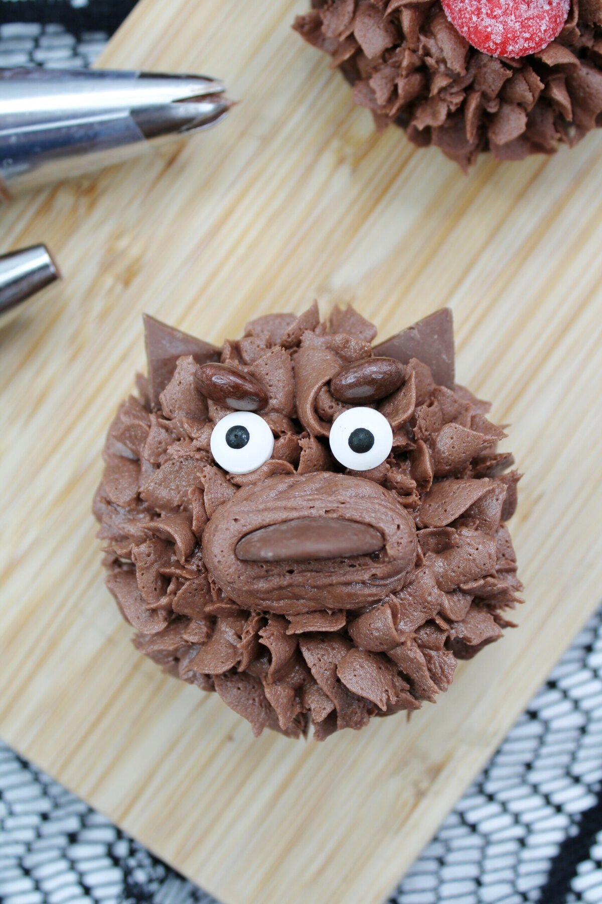 Adding the ears onto the Werewolf Cupcakes.