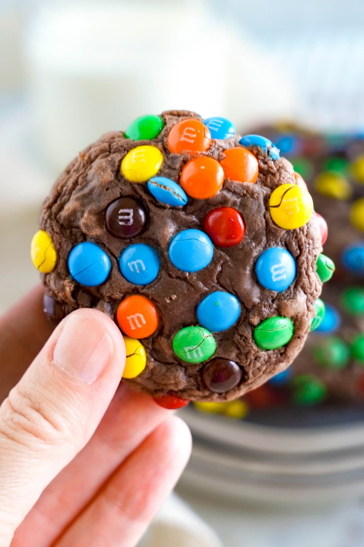 holding an M&M Brownie Cookie