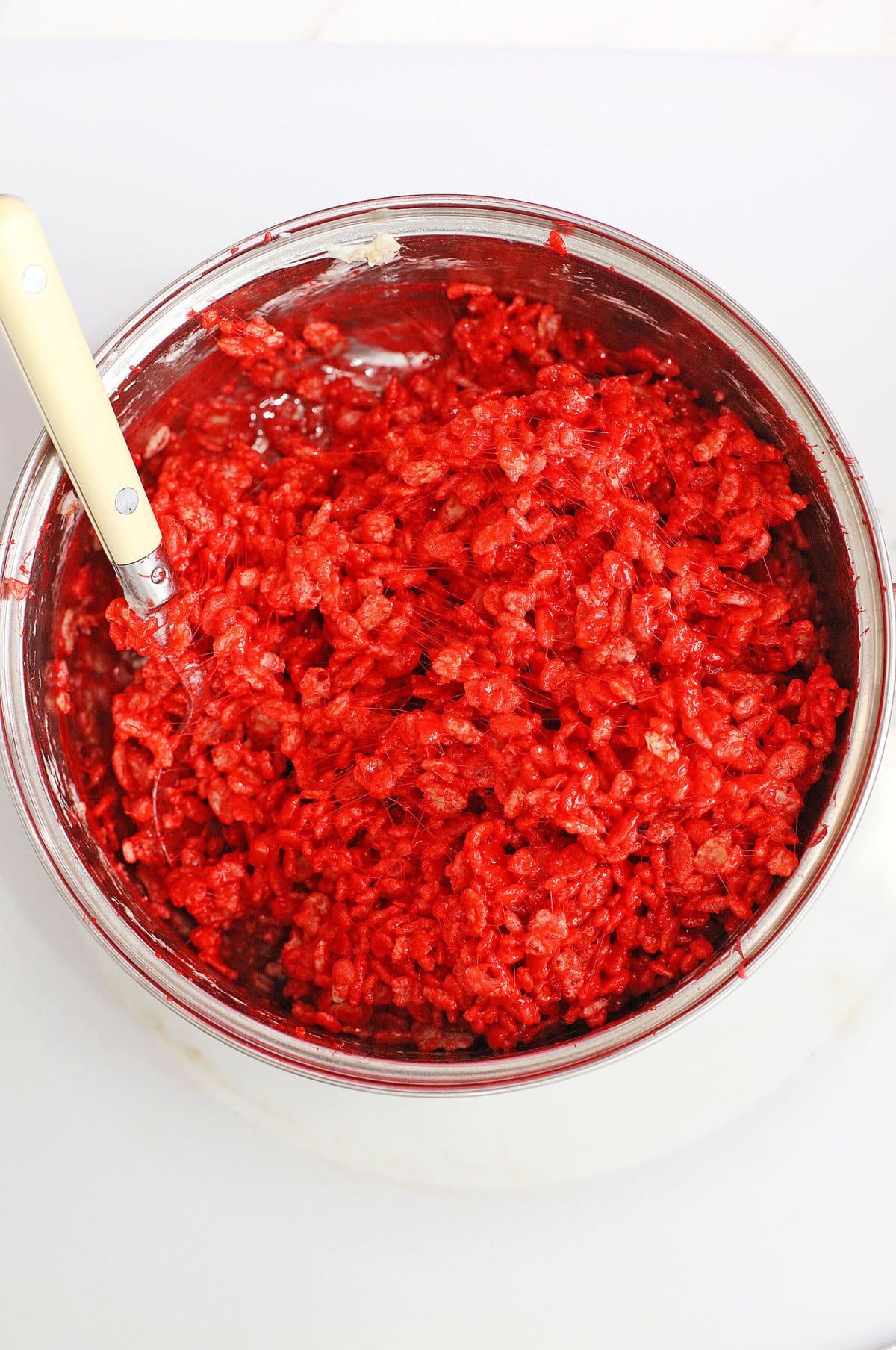 Mixing in the red food coloring.