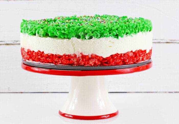 Christmas Rice Krispie Cheesecake on a stand.