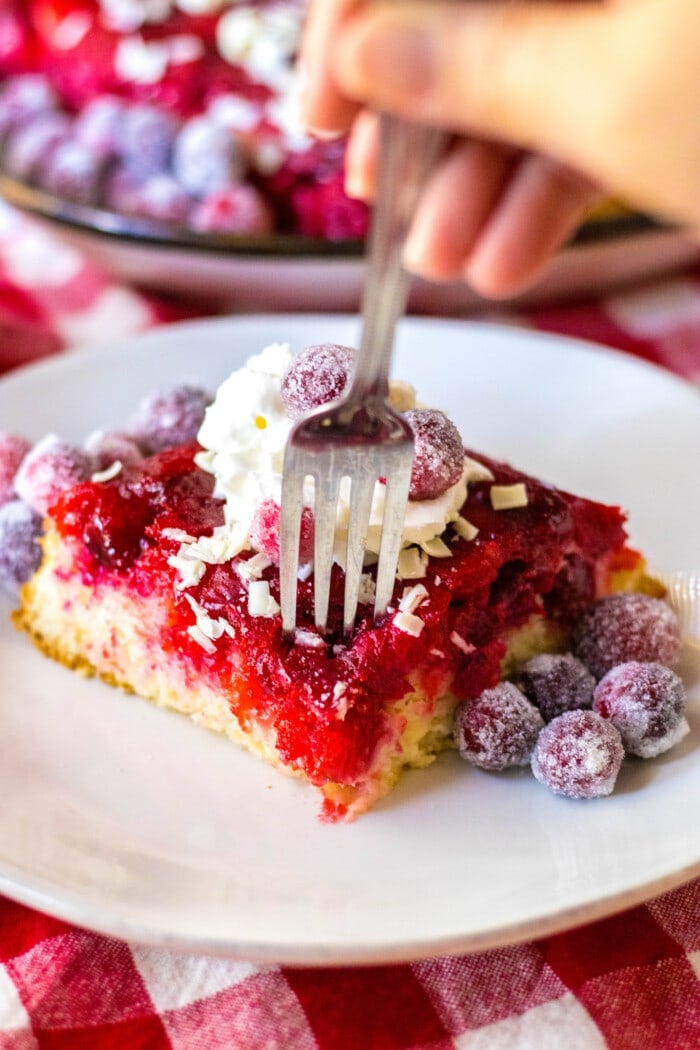 Sticking a fork into the Cranberry Upside-Down Cake.