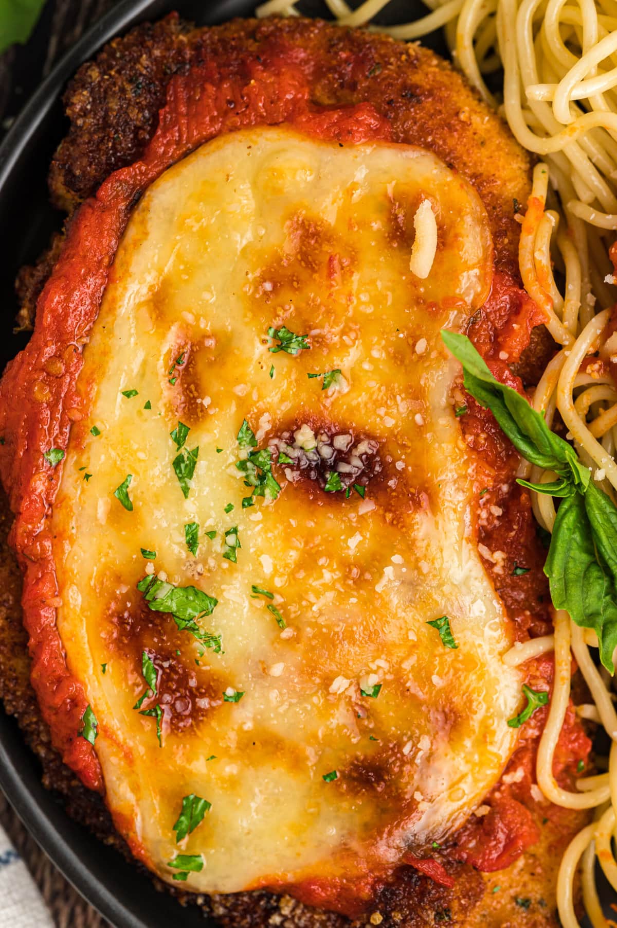 Close-up of a piece of chicken parmesan