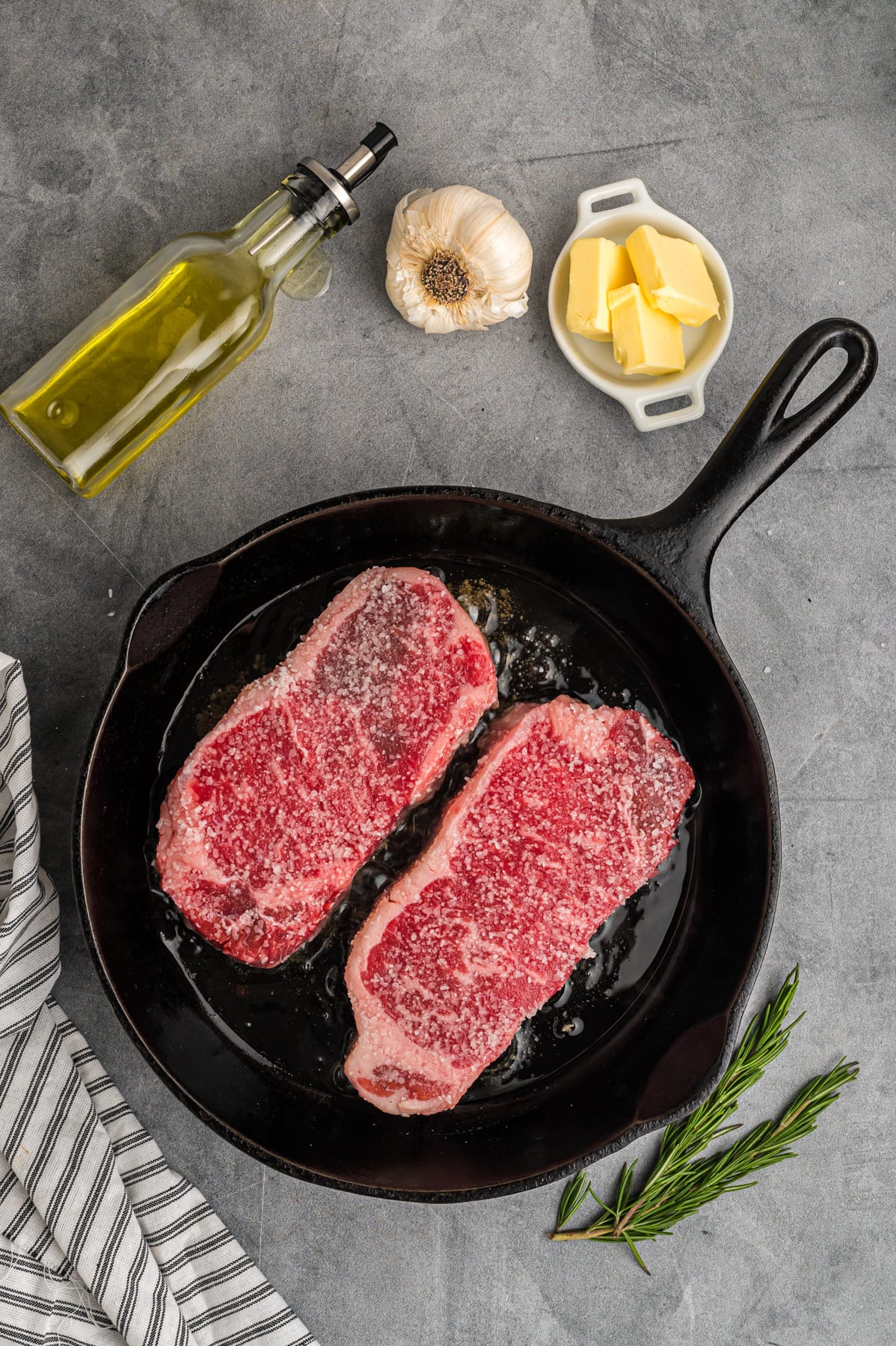 Two steaks in a cast iron skillet