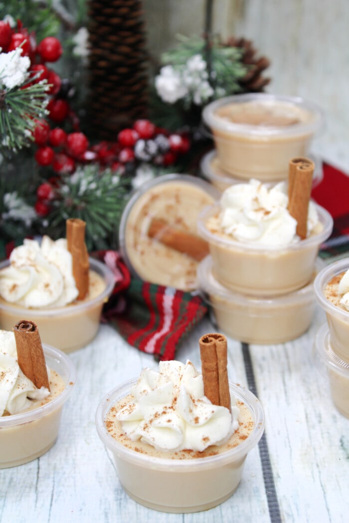 Eggnog Jello Shots topped with whipped cream.