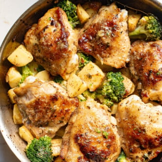 Close-up of honey mustard chicken thighs with potatoes and broccoli
