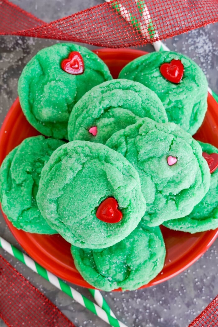 Grinch Cookies in a pile on a plate.