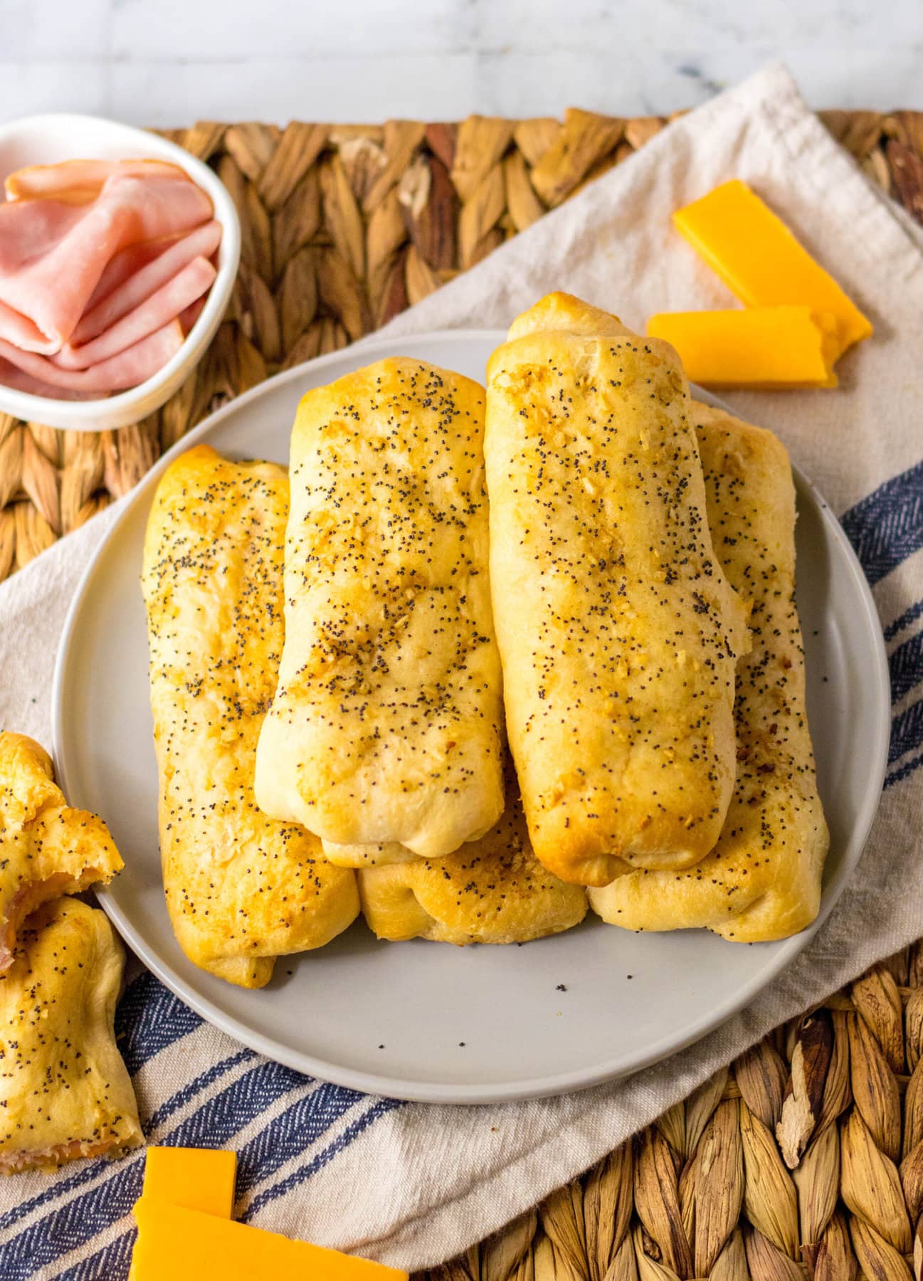 Ham and Cheese Sticks in a pile on the plate.