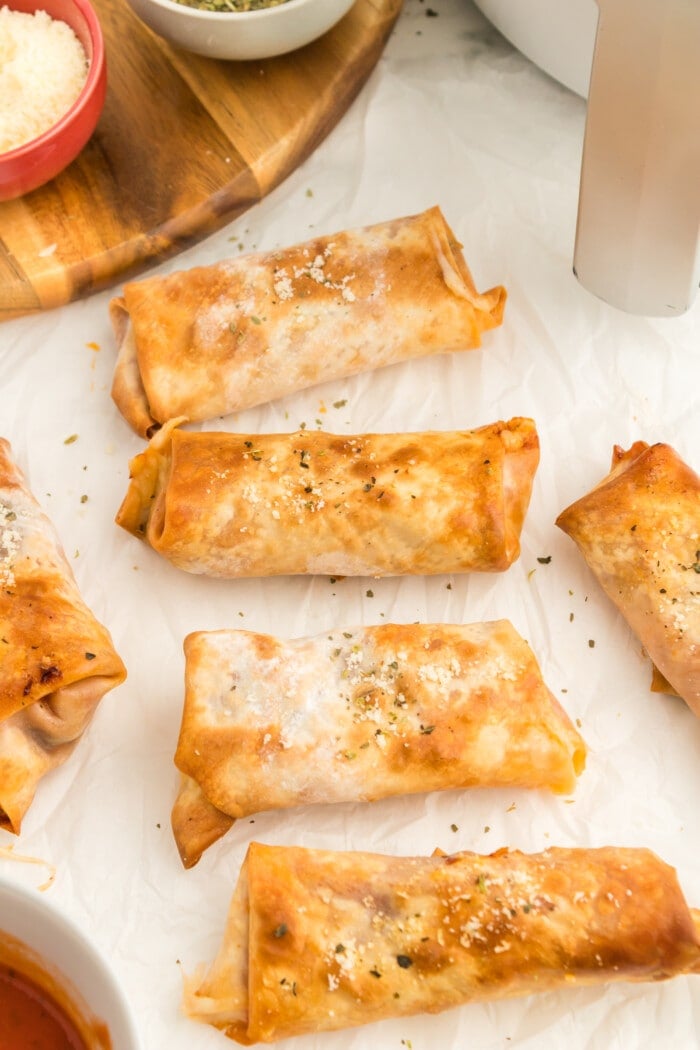 Pizza Egg Rolls topped with seasoning.