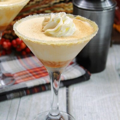 Salted Caramel Pumpkin Martini topped with a dollop of whipped cream.