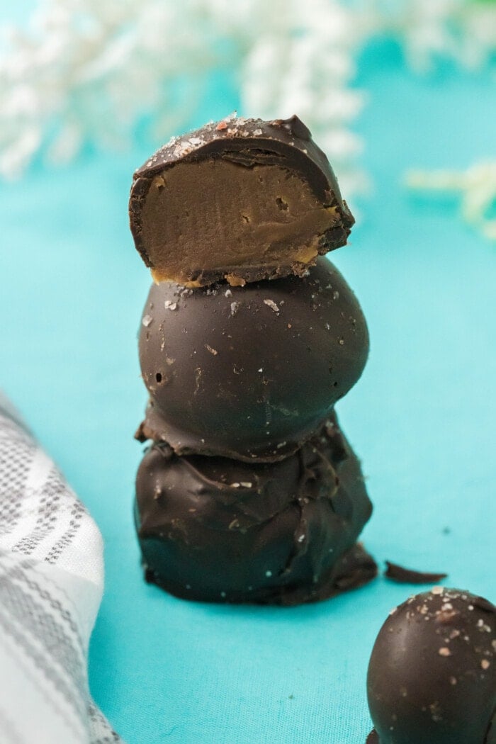 Salted Caramel Truffles stacked on top of each other.