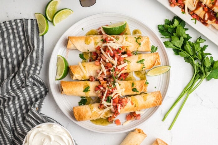 Air Fryer Chicken Taquitos on a white plate.