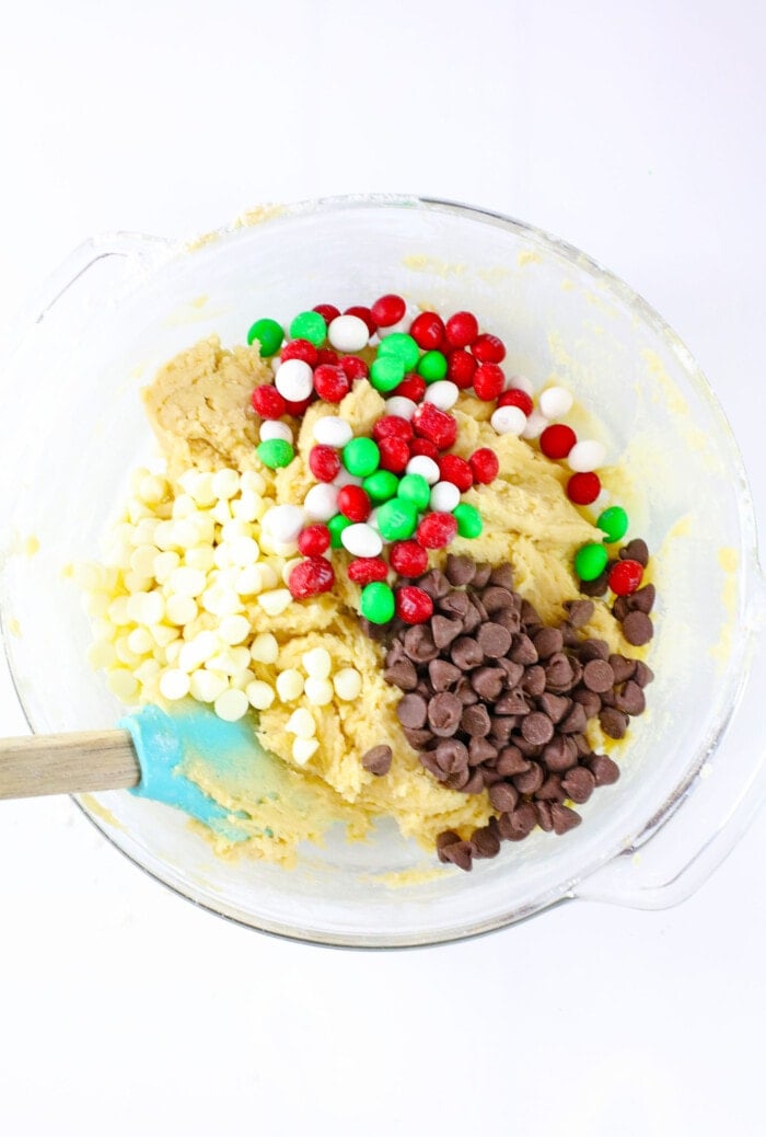 Mixing in the M&M's and chocolate chips.