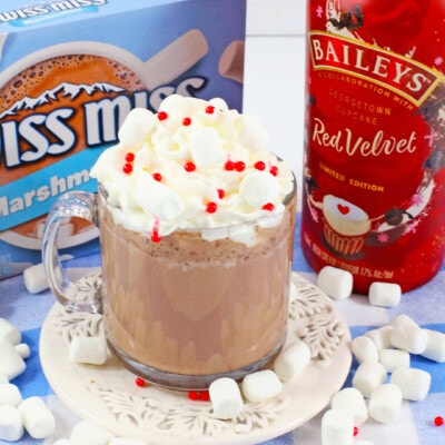 Bailey's Red Velvet Hot Chocolate in a clear glass mug.