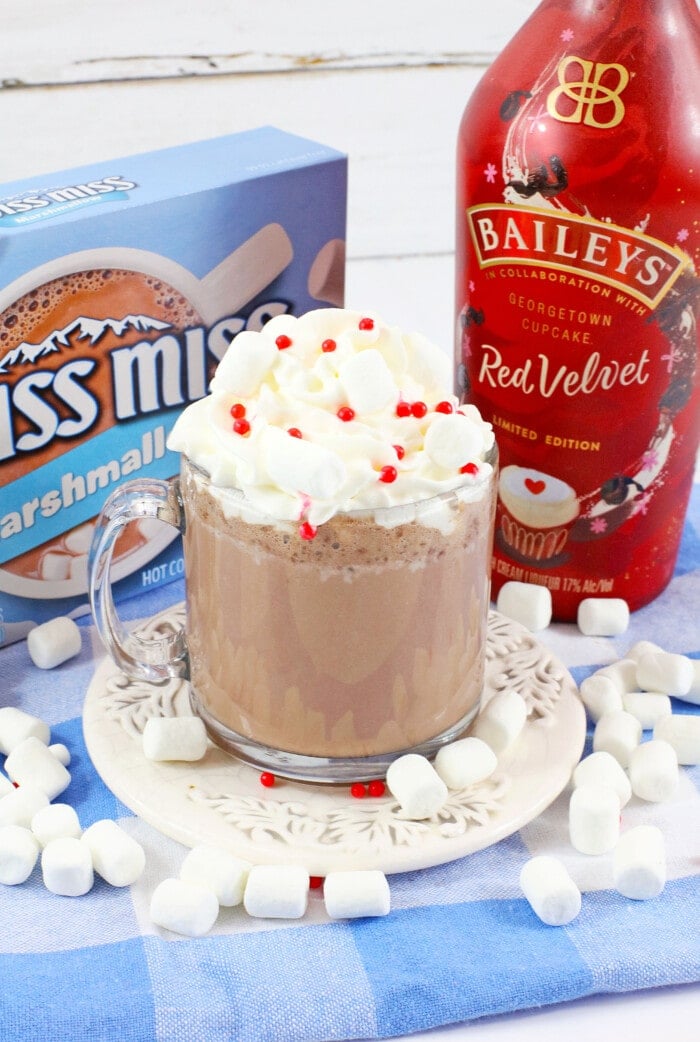 Red Velvet Hot Chocolate surrounded by marshmallows.