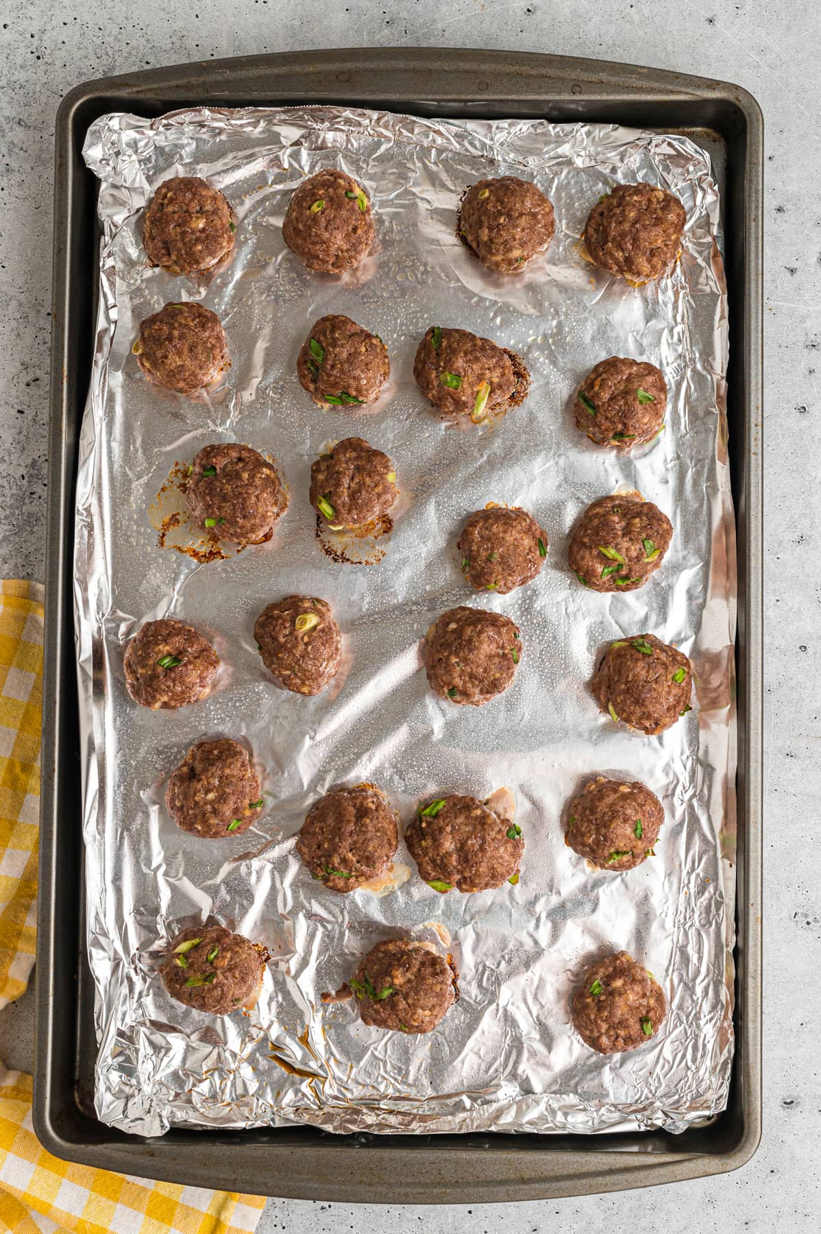 Baked meatballs on a baking sheet