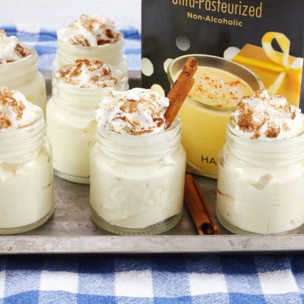Eggnog Pudding Shots on a checkered table.