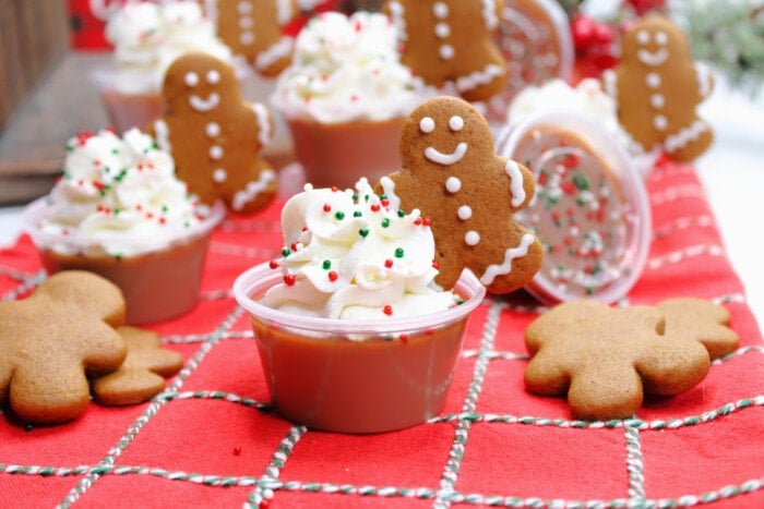 Gingerbread Jello Shots with small gingerbread cookies on top.