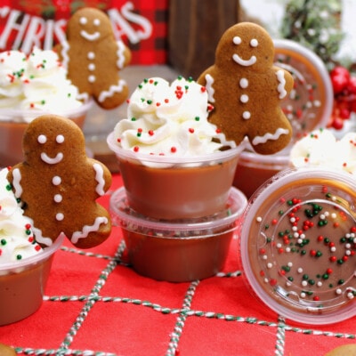 Gingerbread Jello Shots topped with whipped cream.