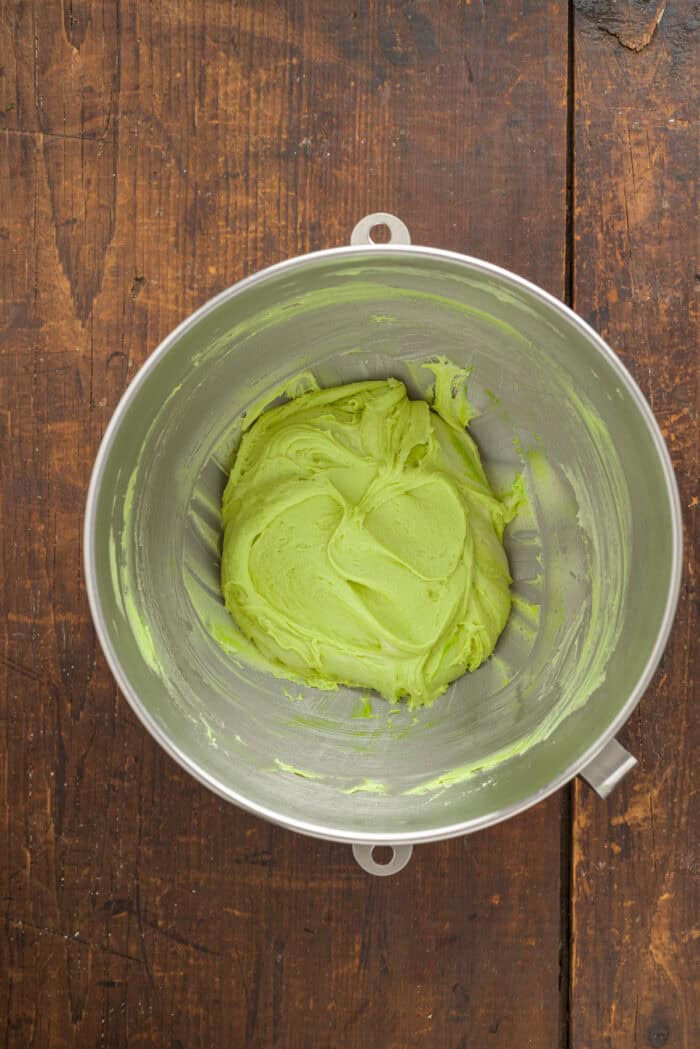 Green cookie dough in a mixing bowl