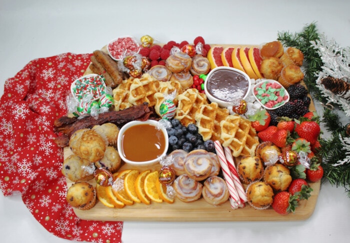 Holiday Breakfast Charcuterie Board on a red table cloth.