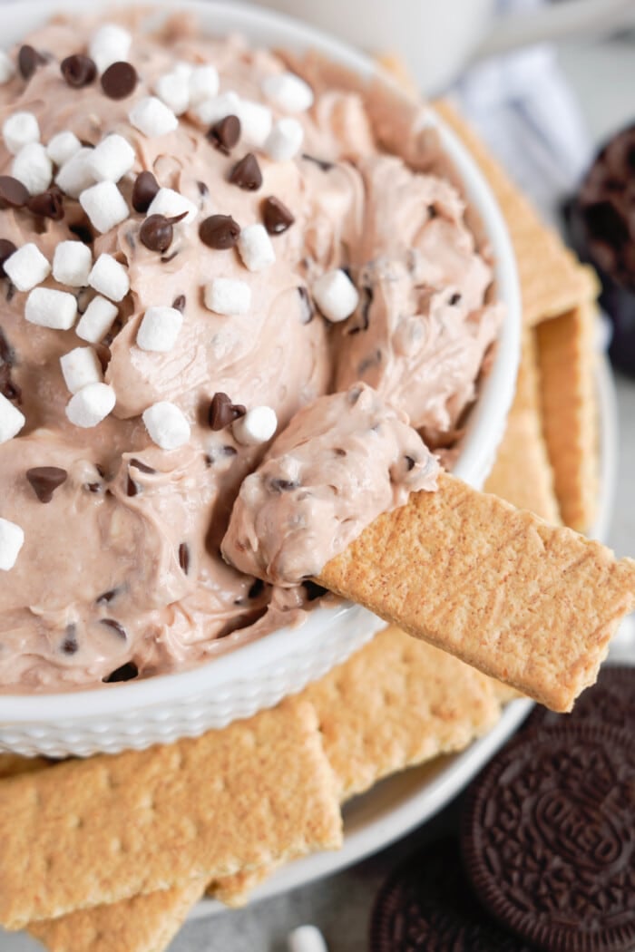 Dipping a cracker into the Hot Chocolate Dip.