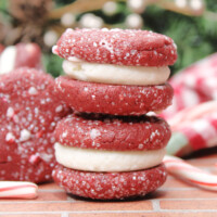 Two Red Velvet Sandwich Cookies stacked on eachother.