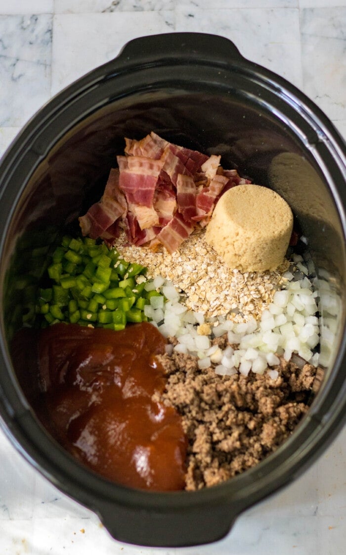 Adding the ingredients into the slow cooker.