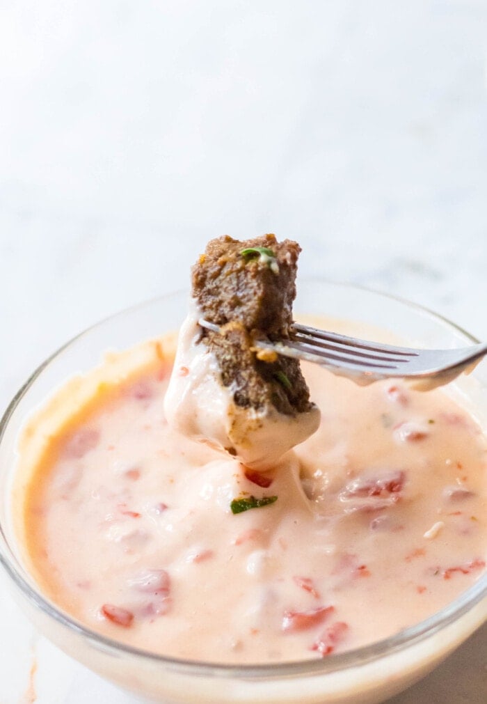 Mexican Steak Bite dipped in Queso