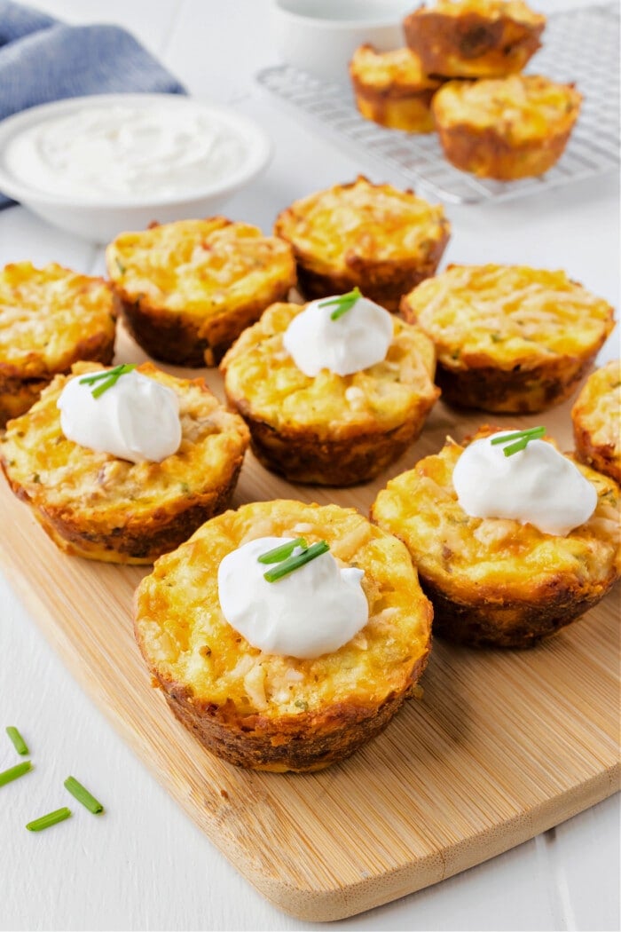 mashed potato puffs with sour cream and chives on board