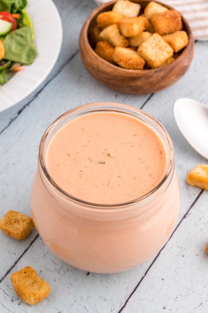 russian dressing in clear glass jar with croutons