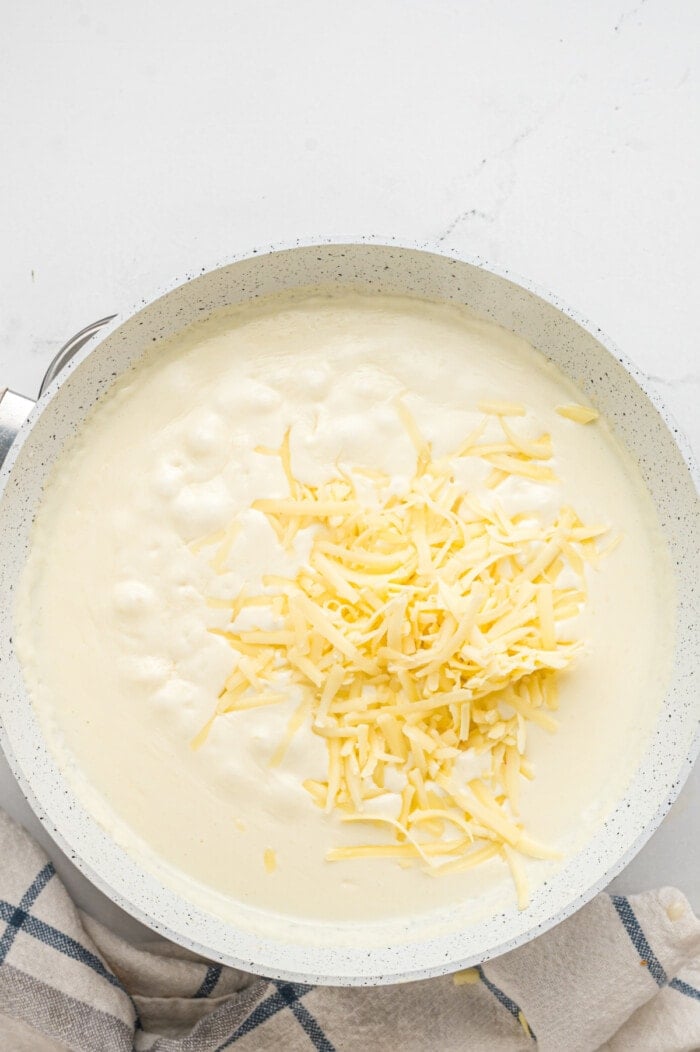 cheese added to saute pan for broccoli cheddar soup
