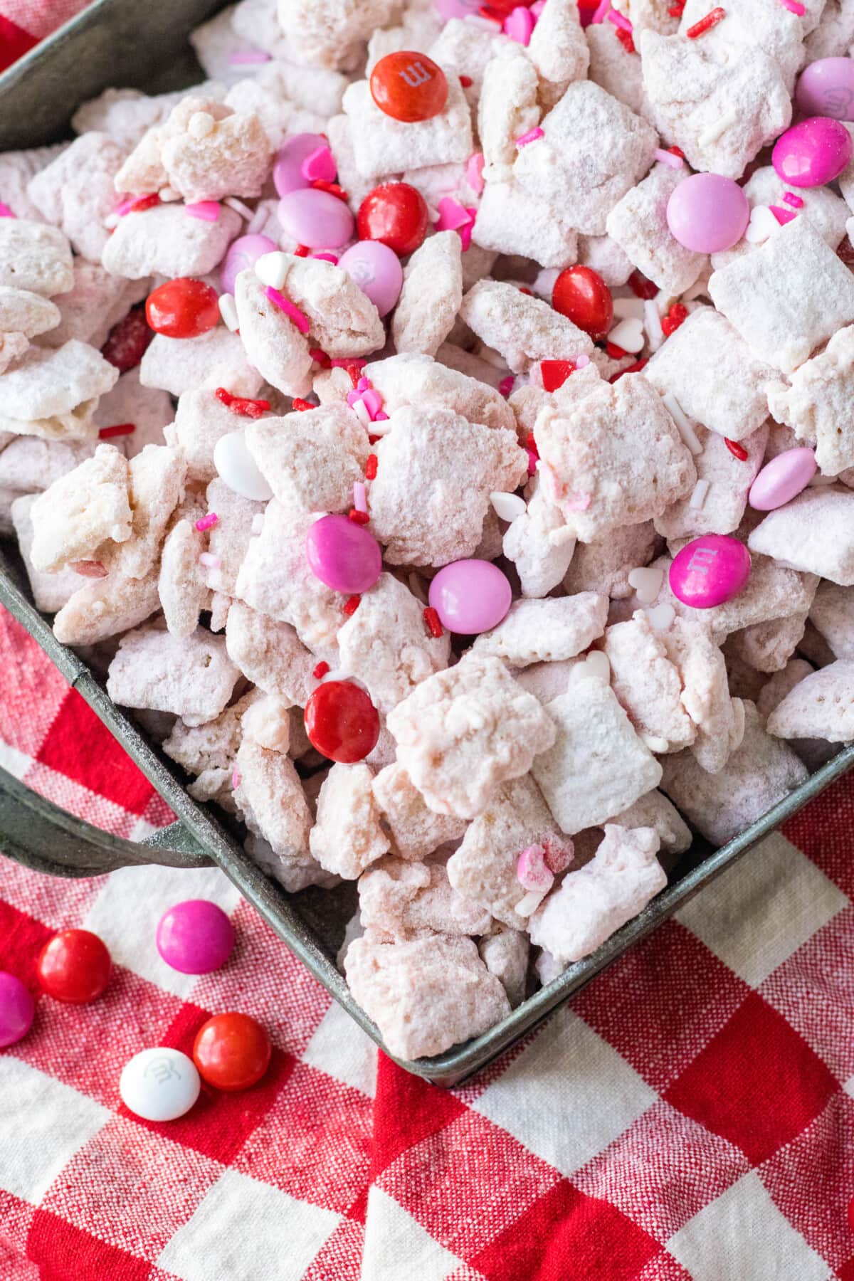 Strawberry Puppy Chow on a red checkered cloth.
