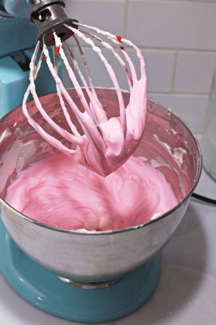 Adding in the pink food coloring.