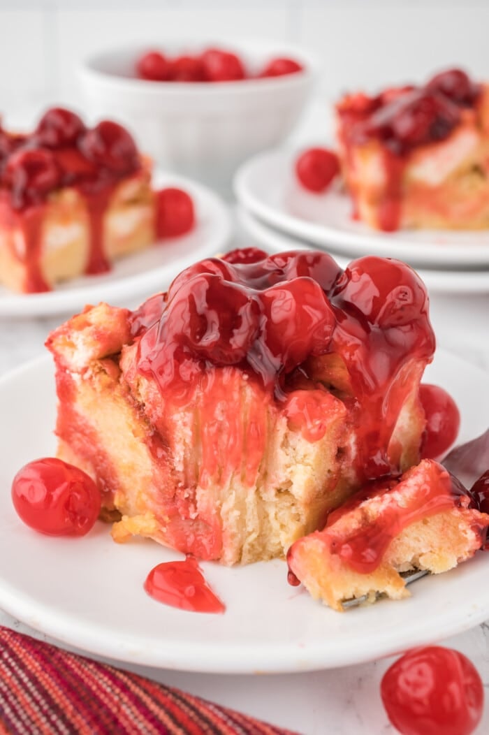 Cherry Bread Pudding on a white plate.