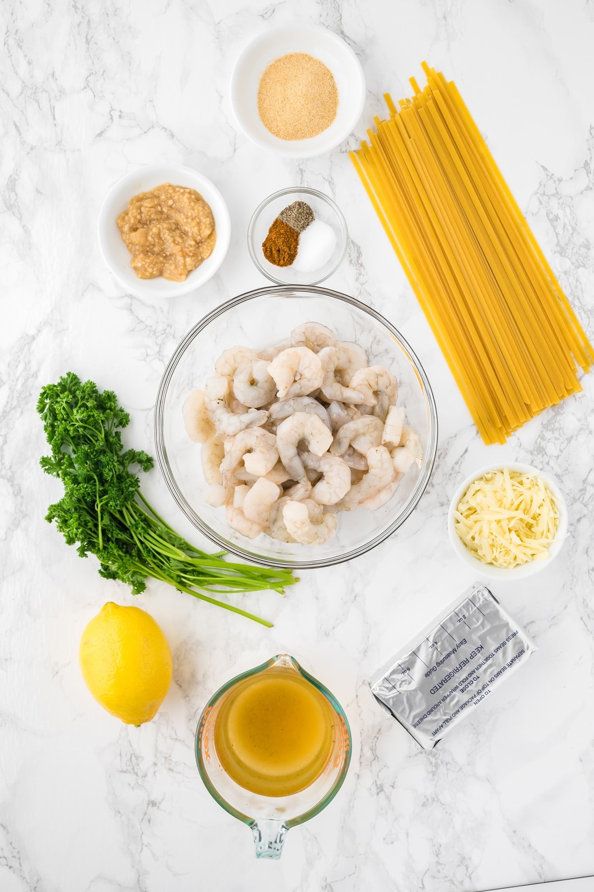 Overhead view of creamy shrimp pasta ingredients