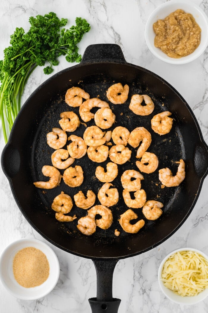 Cooked shrimp in a cast iron skillet