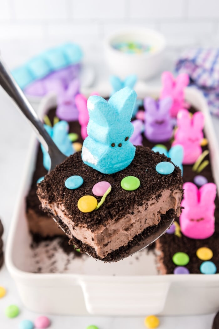 Easter Dirt Cake slice on a spatula.
