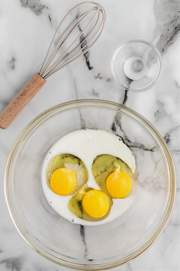 eggs and milk in clear glass bowl 