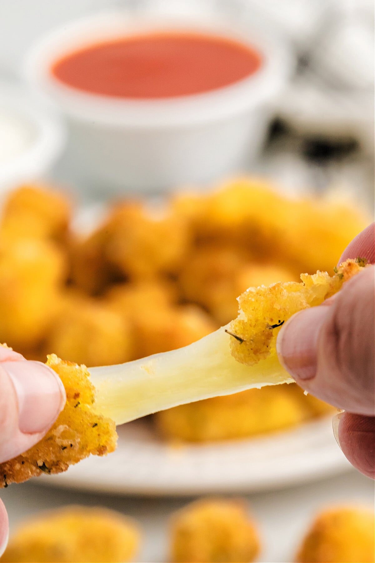 homemade cheese curds with cheese pulled